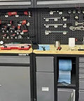 Heavy Duty Steel Tool Cabinet With Doors Rolling Lockable Storage Chest Featuring Pegboard Durable Garage And Warehouse Organization For Tools And Equipment, front view with tools