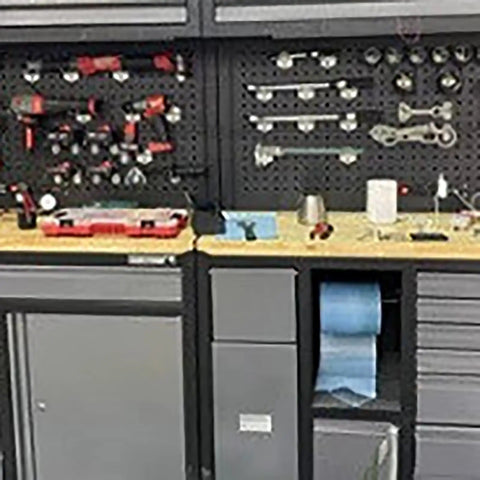 Heavy Duty Steel Tool Cabinet With Doors Rolling Lockable Storage Chest Featuring Pegboard Durable Garage And Warehouse Organization For Tools And Equipment, front view with tools