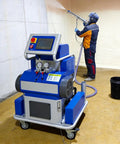 Pro Electric Airless Foam Insulation Spray Gun For Polyurethane Application in use, applying foam insulation on a wall.
