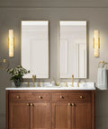 Brushed Brass And Natural Alabaster Wall Sconces Set Of Two casts a super chill ambient glow over modern bathroom sink.