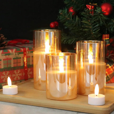 Gold Glass Flameless LED Candles Set Of 3 With 10Key Remote And Timer Real Wax Finish Warm White Flicker on festive tabletop