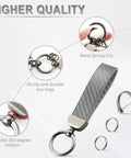 Premium Genuine Leather Car Keychain Featuring Slick Carbon Fiber Wrap And Anti Lost D Ring Built On Solid Zinc Alloy Base With Dual Split Rings For Everyday Ride Gear In Sharp Grey Finish showcasing metal spring clip and key rings.