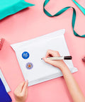 Person decorating white poly mailer with stickers. Bulk Pack Of 400 Poly Mailers 14.5x19 Inches Self Sealing Waterproof Heavy Duty Shipping Bags