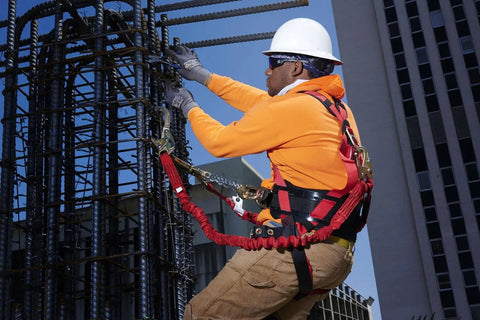 Worker wearing Premium EagleLite Harness With Tongue Buckles And 3 Steel D Rings For All Day Fall Protection On Construction And Industrial Jobsites