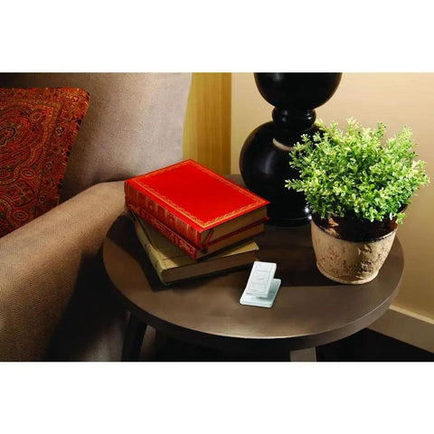 Smart Lighting Pedestal for Pico Remote With Weighted Non Slip Base on corner table with books and plant