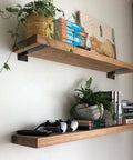 Two wooden shelves supported by Beefy Heavy Duty Floating Shelf Brackets Set 0.2 Inch Thick Industrial Black Steel L Brackets