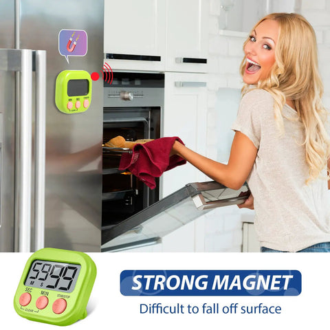 Woman placing tray in oven, using Set Of 30 Multicolor Digital Kitchen Timers With Magnetic Mount Loud Alarm And Big Digits Countdown To 99 Minutes 59 Seconds Lit on fridge.