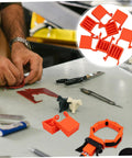 Four Pack Ratchet Band Clamp Blocks For Woodworking on a workshop table with tools, shown in close-up view