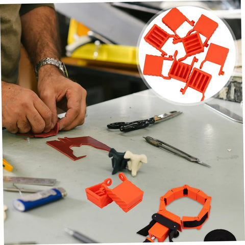 Four Pack Ratchet Band Clamp Blocks For Woodworking on a workshop table with tools, shown in close-up view