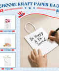 White Kraft Paper Gift Bags With Handles Bulk 5.25 X 3.75 X 8 Inches 1000 Pack Eco Friendly Recycled Paper For Small Business Made In USA Great For Party Favors Weddings Boutiques Retail Stores, being decorated with handwriting.