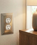 Satin Nickel Single Duplex Outlet Wall Plate Cover With Matching Screws, Heavy Duty Cast Metal Construction, installed by a lamp