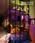 Motion Sensor Puck Lights With Remote No Fuss 2400mAh Rechargeable RGBW Wireless Under Cabinet Lighting Kit illuminating a glass shelf.