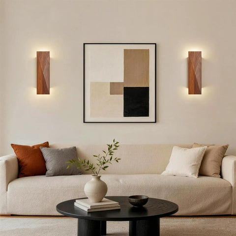 Feasey Set of 2 Walnut Wood Wall Sconce, Vintage Wall Mounted Light Fixture illuminating a modern living room with artwork.