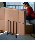 Carton Stand For Boxes With Swivel Wheels And Locking Casters On The Go Portable Cardboard Storage Cart in home setting, black finish
