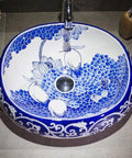 Slick Oval Vessel Sink For Bathroom Vanity Top Notch Premium Porcelain Countertop Wash Basin Featuring Hand Painted Lotus Bird Motif And Smooth High Gloss Finish, oval sink with blue floral design.