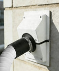 Slick White Wall Penetration Cover Kit For Ac Line Sets With Split Design To Hide Pipes, secured on brick wall and preventing leaks.