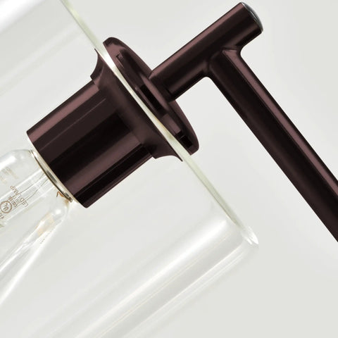 Close-up of Tall Edison Bulb Floor Lamp With Glass Shade In Bronze Finish, showcasing the bulb holder and glass detail