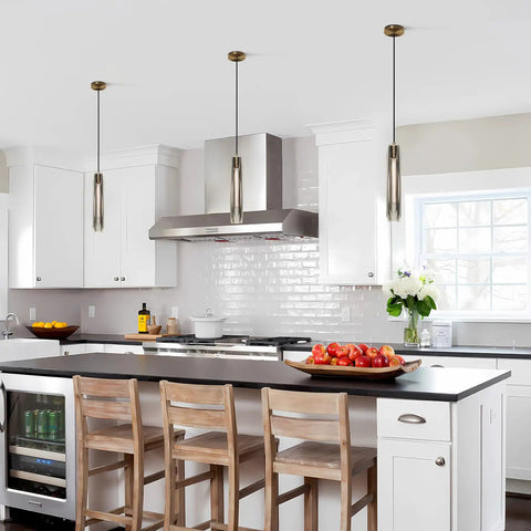 Smokey Crystal Pendant Light In Antique Brass Gold Finish hanging over a kitchen island with modern decor.