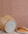 Handpainted Ceramic Rice Dispenser With Secure Airtight Lid, Heavy Duty Kiln Fired Grain Jar on a table