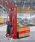 Rock Solid Electric Pallet Stacker With 3300 Lbs Load Capacity And 118 Inch Max Lift Height featuring adjustable forks and boxes in warehouse
