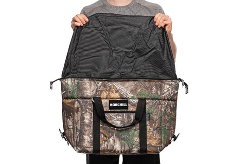 Hella Durable 48 Can Insulated Soft Sided Cooler Featuring Realtree Xtra Camo Shell, opened top view, showing inner lining.