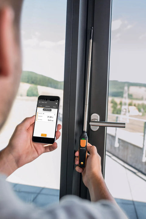 Handheld Air Velocity And Temperature Meter With In-Duct Airflow Measurement, CFM Readout, And A 15 Inch Telescoping Shaft For Easy Spot Checks, Bluetooth Connectivity And Mobile App Control For Quick Duct Diagnostics. used on door frame