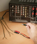 Remote And Local Continuity Tester With Detachable Remote Probe in use for long distance cable testing and tracing setup on a desk