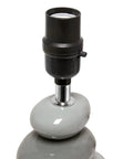 Close-up of Shades Of Gray Ceramic Stacked Stone Table Lamp base with modern design, featuring smooth gray ceramic stones.