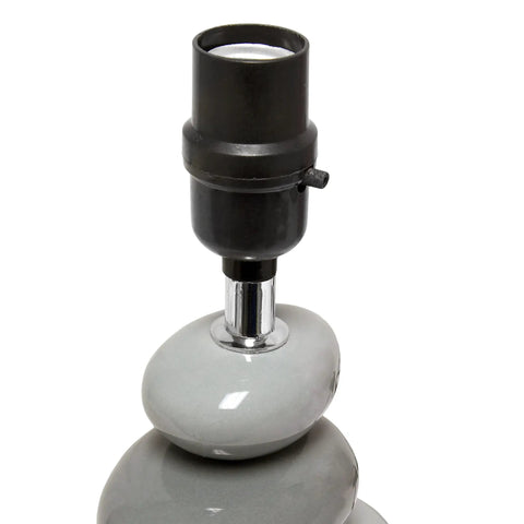 Close-up of Shades Of Gray Ceramic Stacked Stone Table Lamp base with modern design, featuring smooth gray ceramic stones.