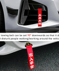 Universal Jdm Car Tow Strap And Racing Trailer Belt With Bold Slogan Graphics positioned at 90 degrees on vehicle bumper.