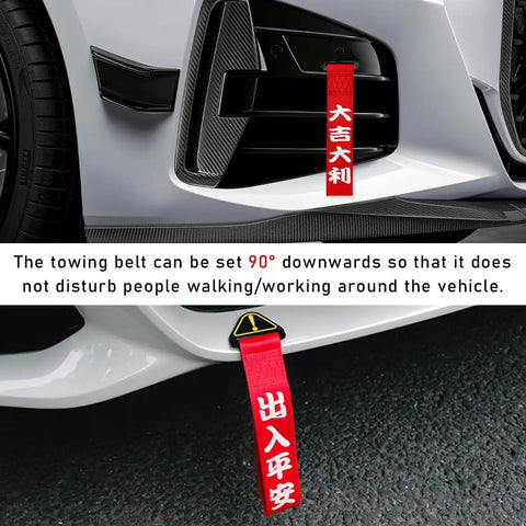 Universal Jdm Car Tow Strap And Racing Trailer Belt With Bold Slogan Graphics positioned at 90 degrees on vehicle bumper.
