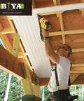 Person using a nail gun on wooden beams under construction with a visible BIYA logo in the top left corner.