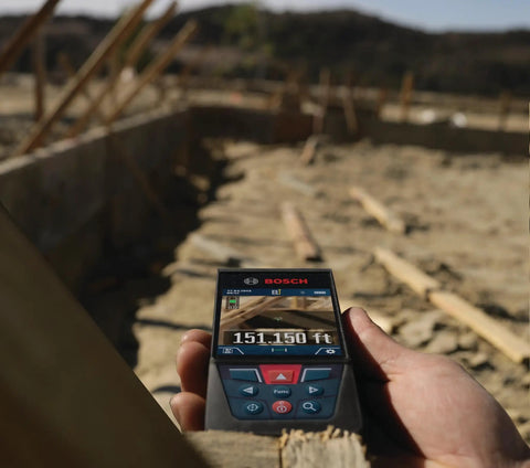 Beast Of A Blaze Outdoor Connected Laser Measure With 400 Ft Range and backlit display used at construction site