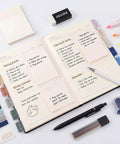 All In One College Stationery Gear With Large Pencil Case, Black Gel Pens, open notebook with sticky notes and pastel highlighters