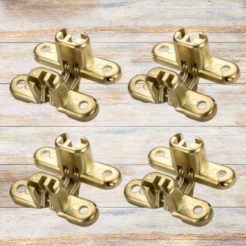 Set of four Hidden Zinc Alloy Concealed Hinges For Doors And Walls on a wooden surface