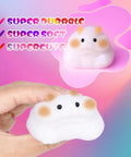 Hand holding a soft, white squishy toy with a cute face, from Ultimate DIY Squishy Kit With 6 Molds And 18Oz Bubble Free Liquid Silicone Quick 2 To 3 Hour Cure With No Fuss Step By Step Guide Perfect Starter Craft Gift For Beginners.
