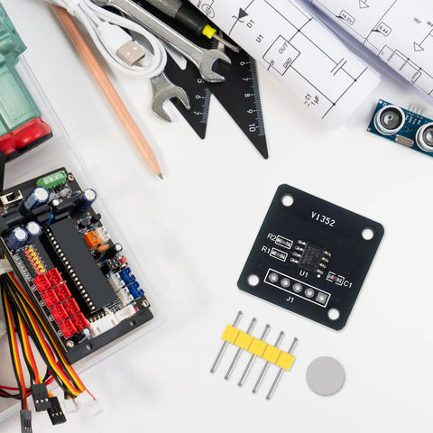 Two Pack MT6701 Magnetic Encoder Module For Angle Measurement, tools, and components on a white surface, ready for robotics projects.