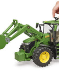 Hand adjusting John Deere 7R 350 Front Loader Tractor Toy Model with openable hood and realistic engine detailing