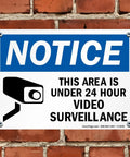 24 Hour Video Surveillance Security Camera Sign 10 By 14 Inch Heavy Duty Plastic Outdoor Notice Plaque mounted on brick wall.