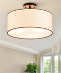 Cool Semi-Flush Mount Ceiling Light With Diffused Drum Shade, Modern Fixture For Bedroom, Living Room, Entryway And Hallway, White Shade With Black Finish, 18 Inch Ceiling Light mounted on ceiling.