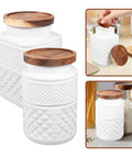 Vintage Matte White Glass Storage Jars With Airtight Wood Lids 1800ML Set Of 2 displayed with wood lids, perfect for storing coffee and dry goods.