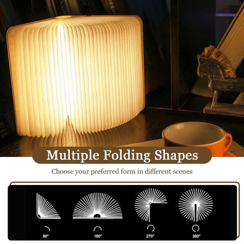 Wooden Folding Mood Light Book Lamp with USB Rechargeable Battery displaying multiple folding shapes on table