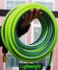 Person holding Heavy Duty Hybrid Air Hose Built To Last Three Eighths Inch By Fifty Feet Flexible And Lightweight No Kink Design