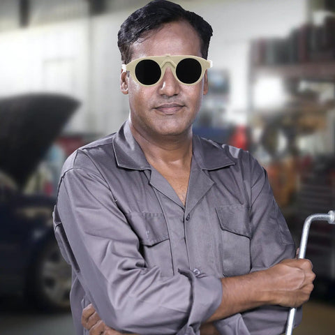 Man wearing Built Tough Welding Glasses and Protective Goggles for Industrial Grinding in a workshop setting.