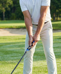 Golfer using True Grip Trainer 2.0 Golf Grip Trainer For Right Hand to improve swing accuracy on lush golf course