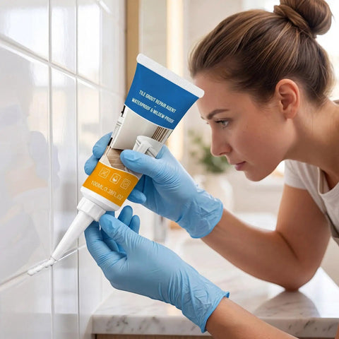 Woman applying Hardcore Grout Repair Sealant For Shower And Bathtub Fast Drying Tile Caulk between tiles.