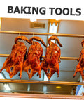 Hanging roast ducks on stainless steel racks, showcasing the Stainless Steel Peking Duck Keeping Tool For Even Cooking.