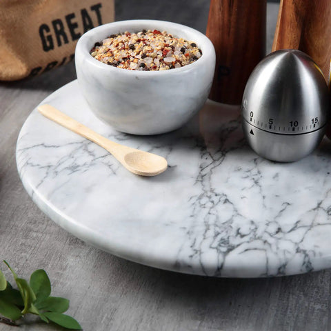 12 Inch Solid Marble Lazy Susan Turntable With Buttery Smooth Swivel Base For Zero Fuss Kitchen Countertop Organization with spices.