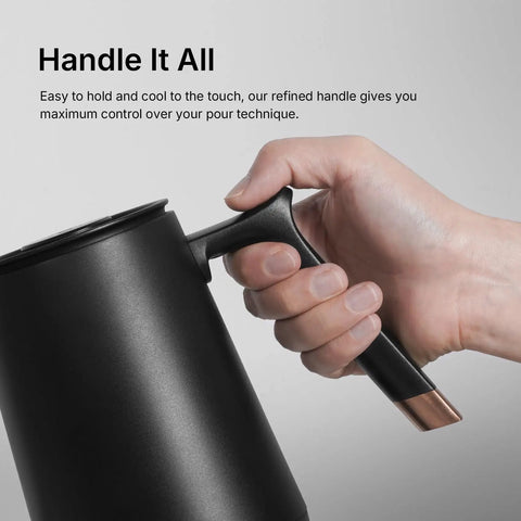 Close-up of a hand holding the handle of the Fish Smart Electric Coffee Kettle 600ML Gooseneck Pour Over Kettle, black stainless steel.