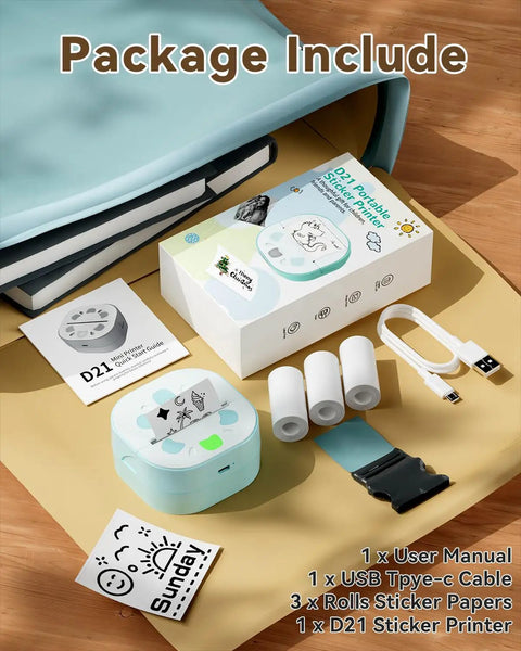 Bluetooth Sticker Printer Mini Portable Sticker Maker With 3 Roll Paper Inkless Thermal Printing For iPhone Notes And Journals DIY Crafts And Kids Gift On The Go shown with accessories on a table including 3 rolls of sticker paper, a USB Type-C cable, and user manual.